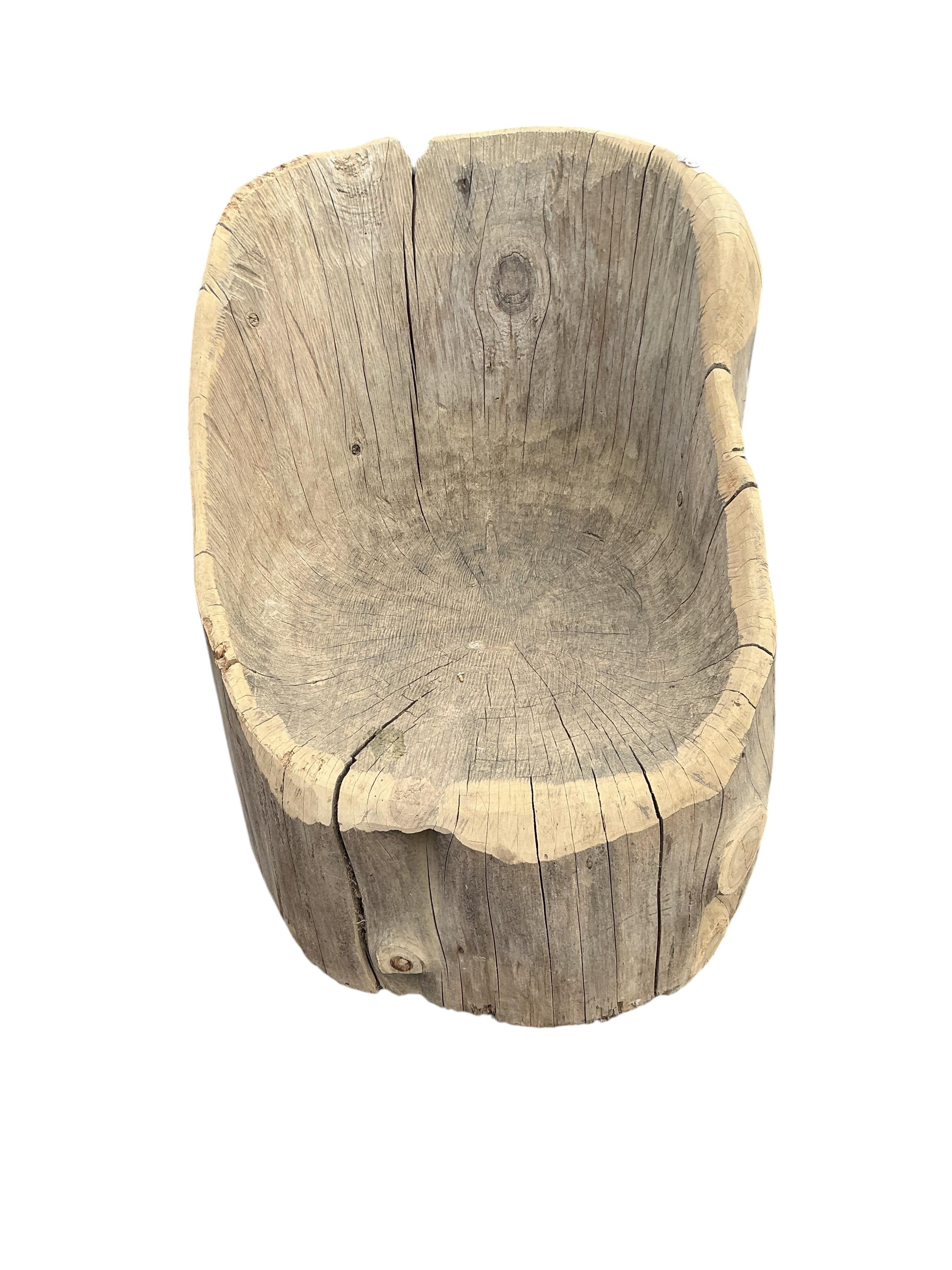 An elm tree section garden seat, width 46cm, height 62cm
